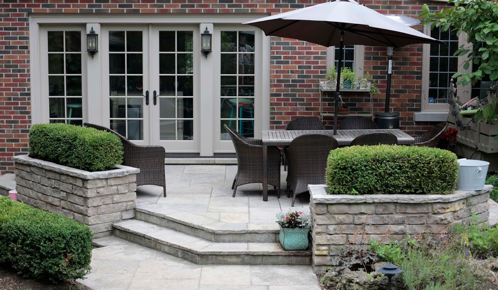 Flagstone Patio with Natural Stone Planters Traditional Patio