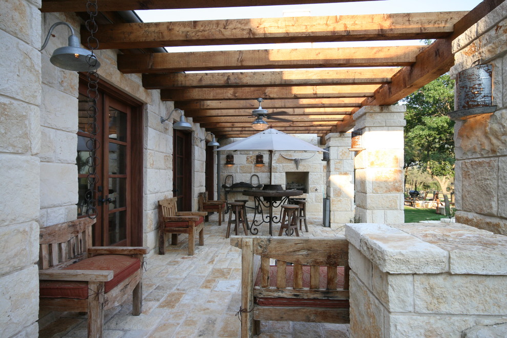 Inspiration for a mediterranean patio in Dallas with a fire feature and a pergola.