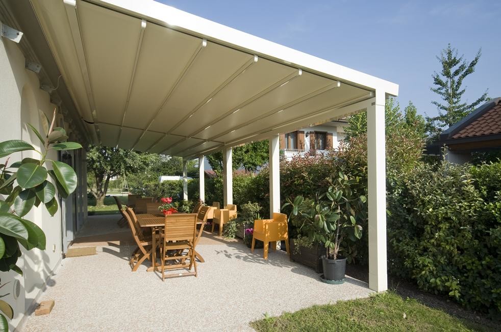 Photo of a medium sized classic back patio in New York with decking and an awning.