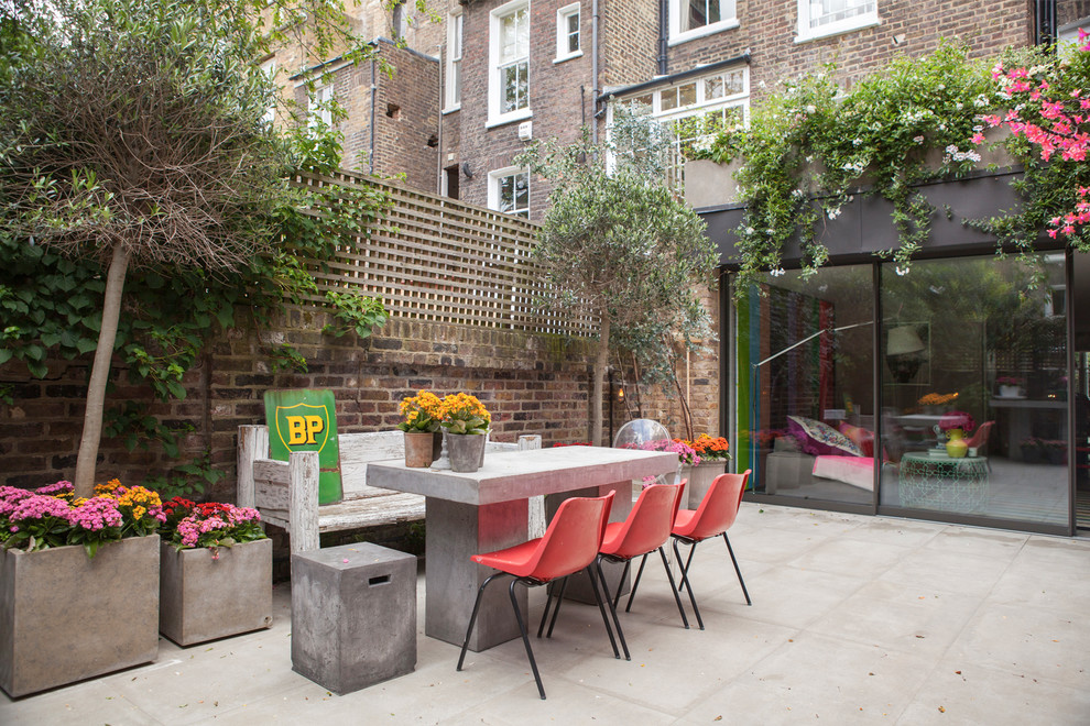 Urban back patio in London with no cover.