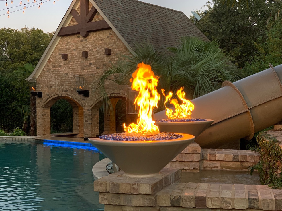 Photo of a world-inspired back patio in Dallas with an outdoor kitchen.