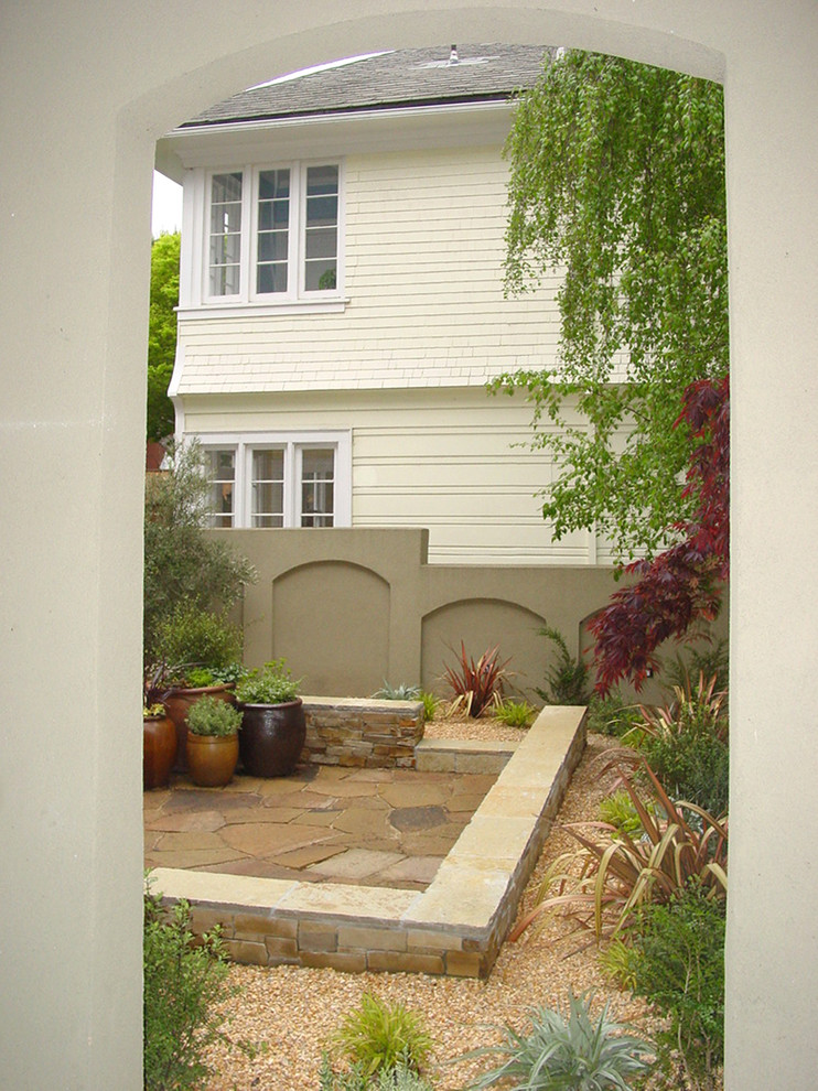 Example of a mid-sized classic backyard stone patio design in San Francisco