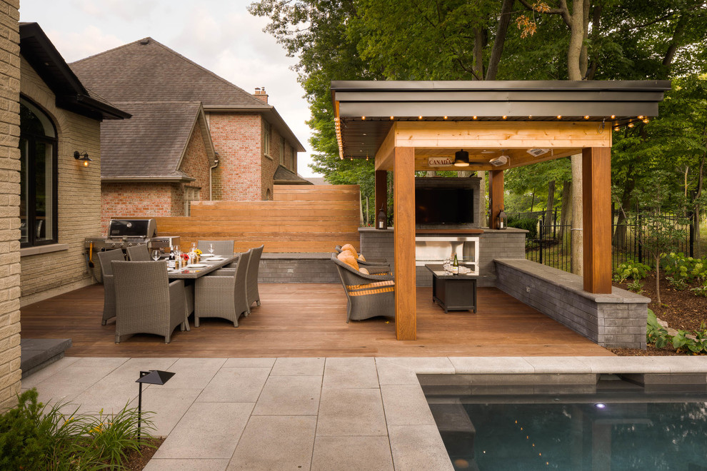 Patio - mid-sized transitional backyard patio idea in Toronto with decking and a gazebo