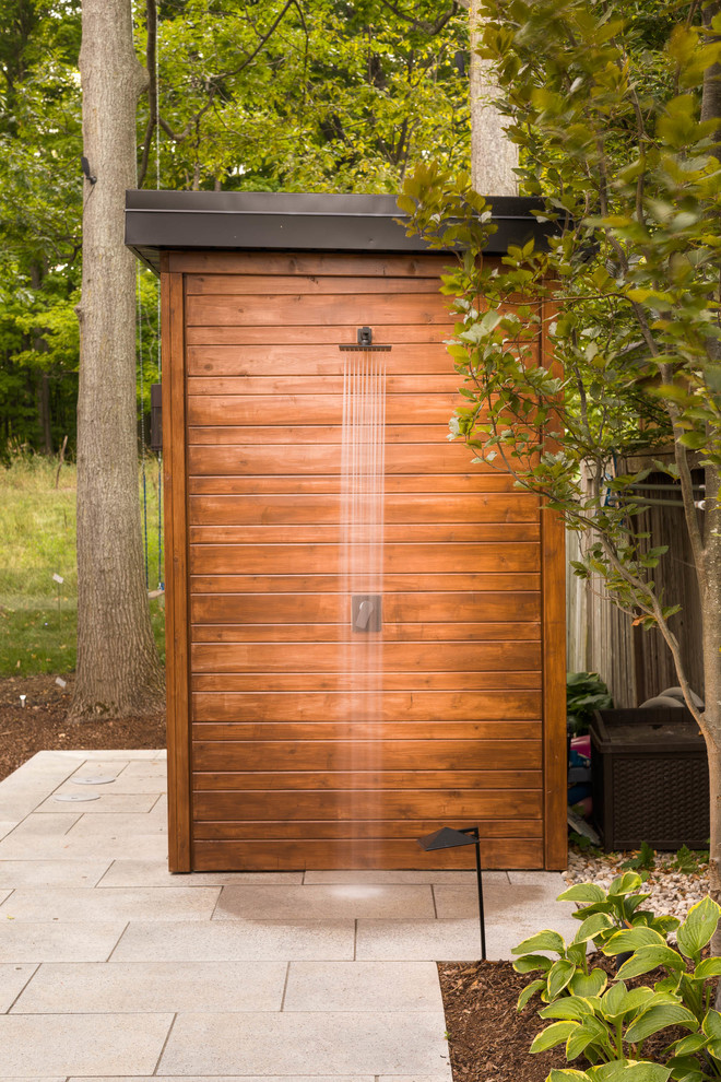 Medium sized traditional back patio in Toronto with concrete paving and an outdoor shower.