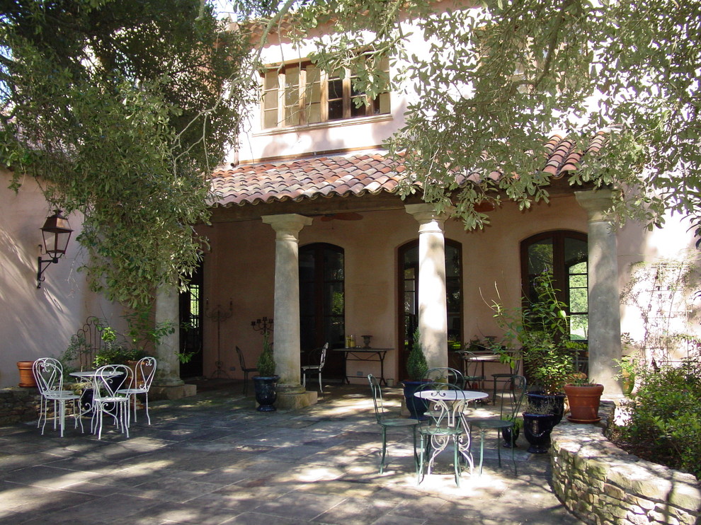 Patio - mediterranean courtyard patio idea in New Orleans