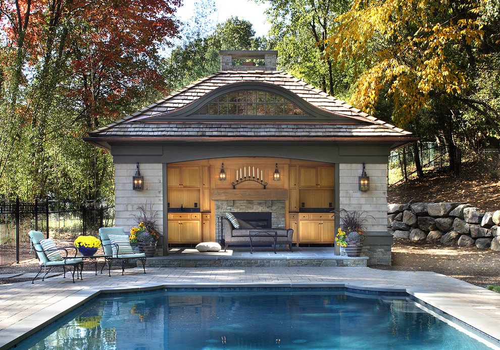 Large elegant backyard brick patio photo in Orange County with a fireplace and a gazebo