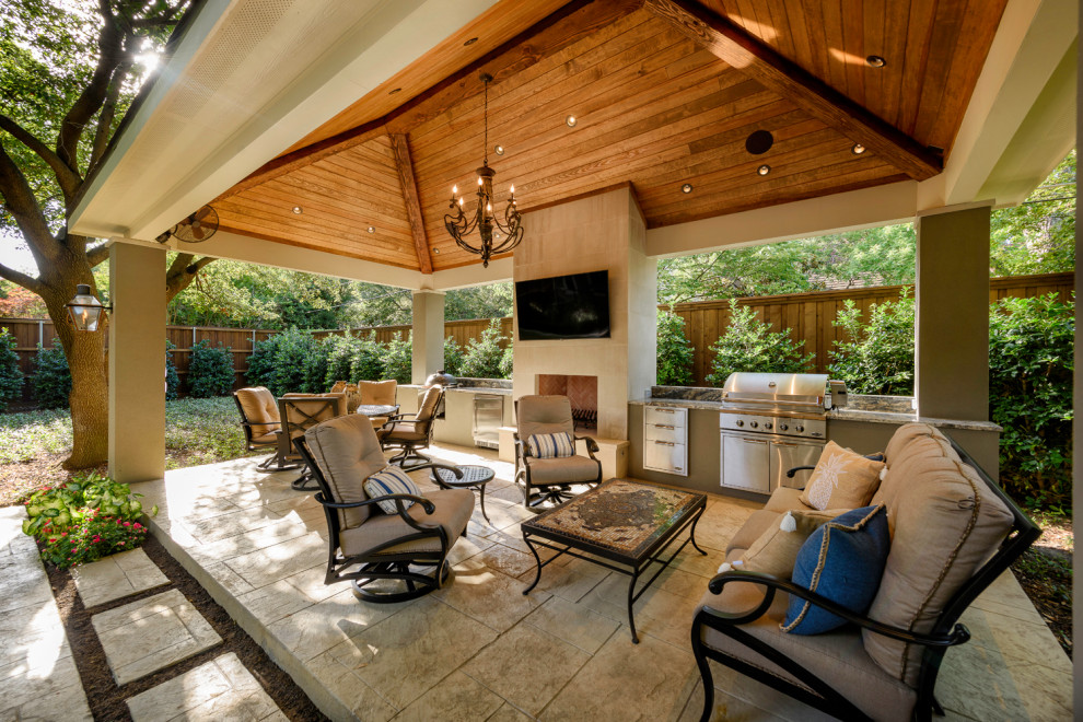 Inspiration for a medium sized back patio in Dallas with a fireplace, stamped concrete and a gazebo.