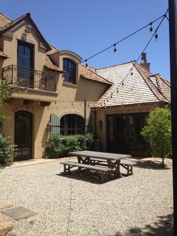 Example of a french country patio design in Phoenix