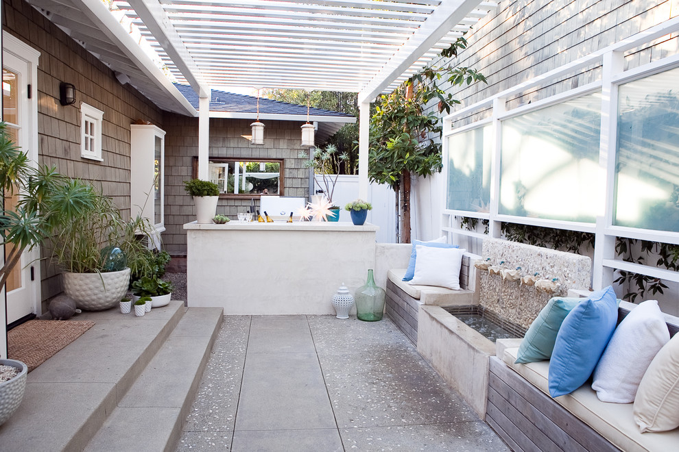 Photo of a classic patio in Los Angeles with a pergola and a bar area.