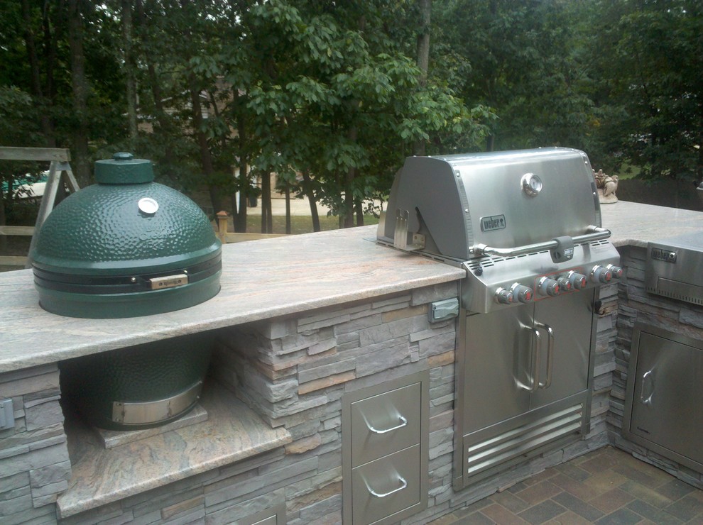 Patio kitchen - transitional backyard concrete paver patio kitchen idea in DC Metro