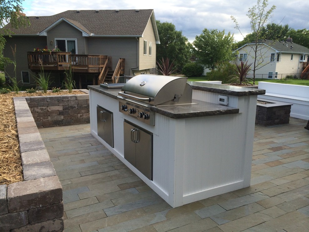 Mid-sized trendy front yard stone patio kitchen photo in Minneapolis