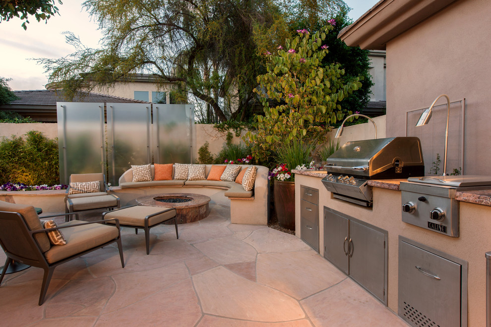 Mid-sized trendy backyard stone patio kitchen photo in Phoenix with no cover