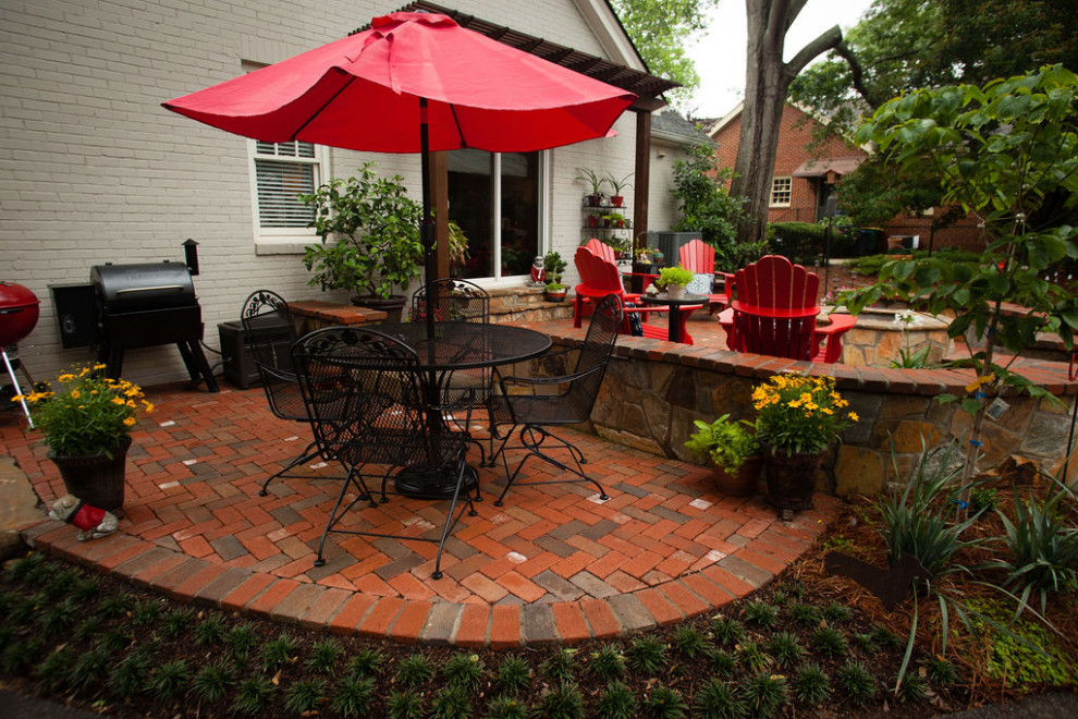 Patio - mid-sized contemporary backyard brick patio idea in Atlanta with a fire pit and a pergola