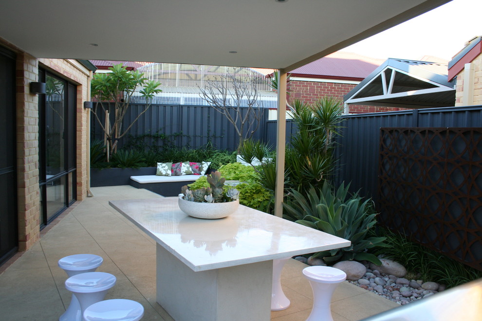 Patio - small tropical backyard patio idea in Perth