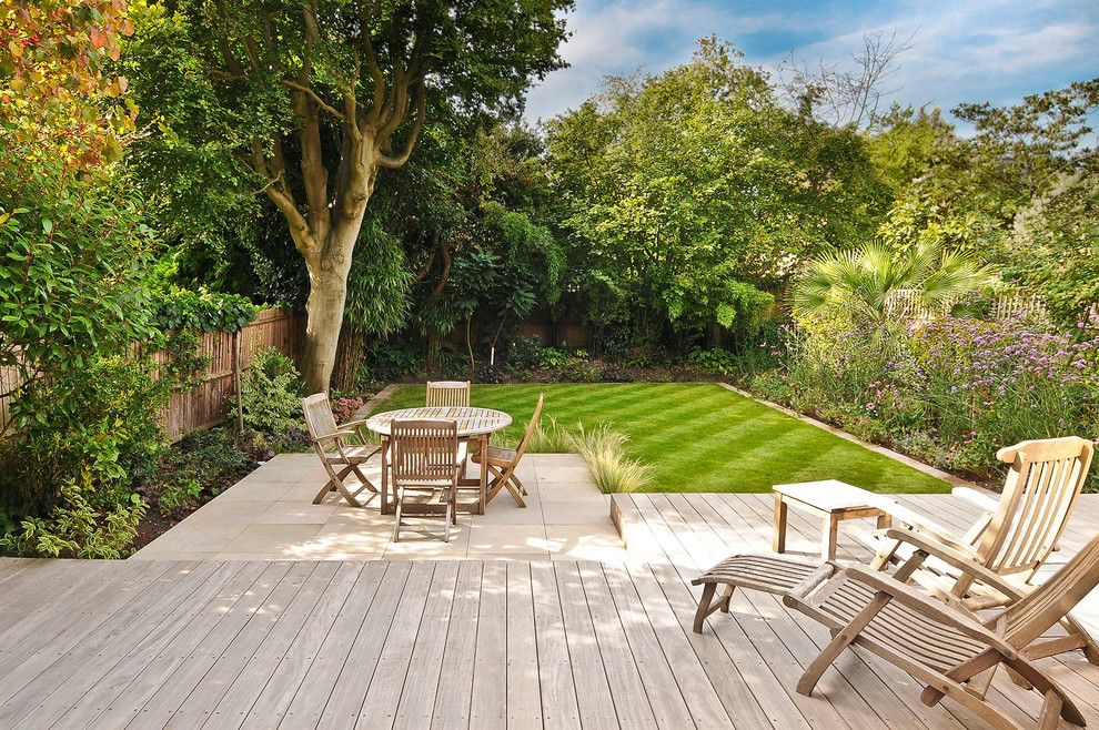 Example of a trendy backyard patio design in London
