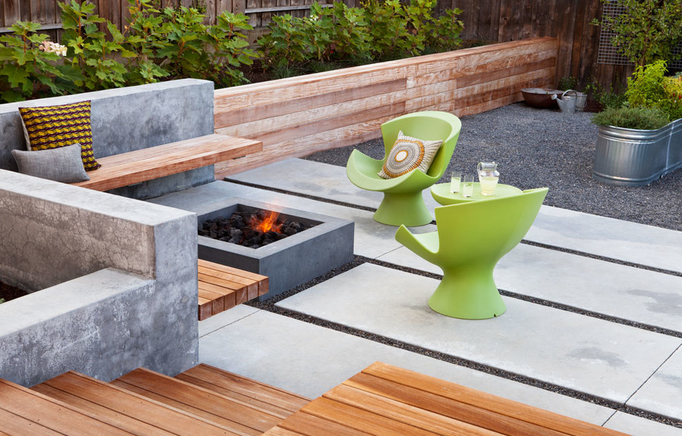 Design ideas for a contemporary back patio in San Francisco with a fire feature, concrete slabs and no cover.