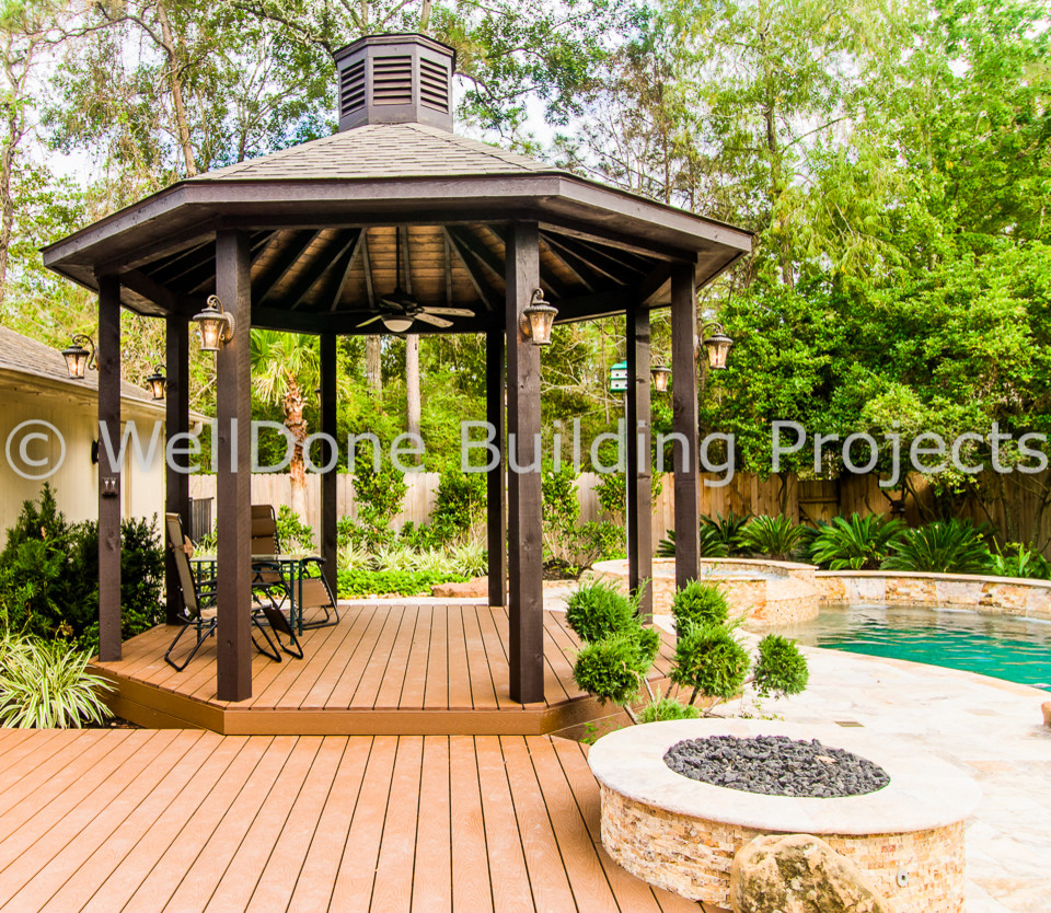 Inspiration for a medium sized traditional back patio in Houston with decking and a gazebo.