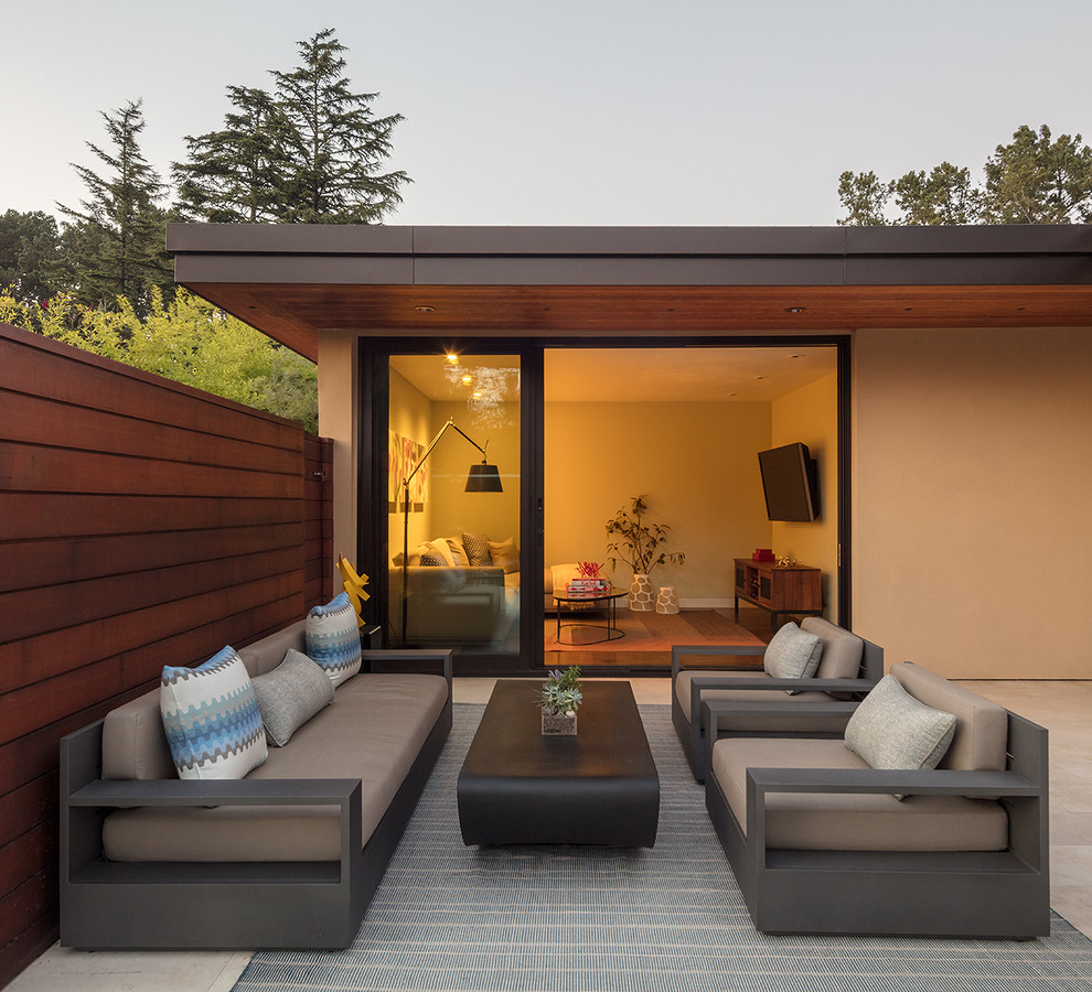 Patio - huge mid-century modern side yard tile patio idea in San Francisco with no cover