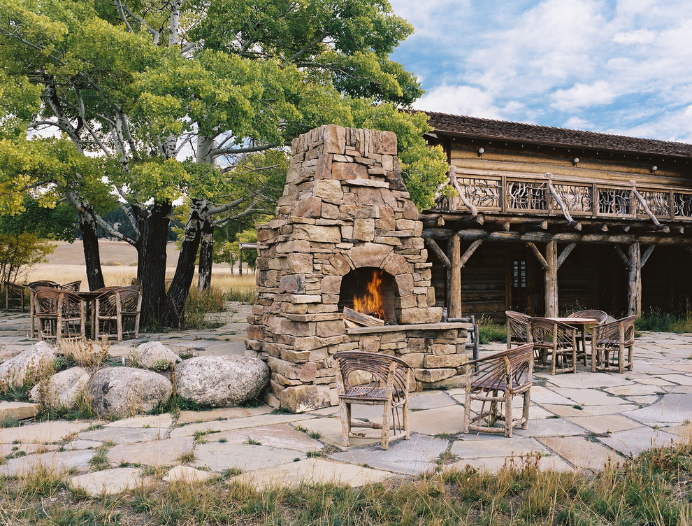 Traditional patio in Other with a fire feature.
