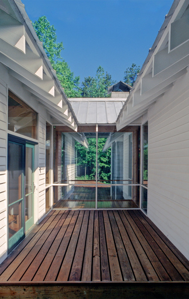 Patio - contemporary side yard patio idea in Atlanta with decking and no cover