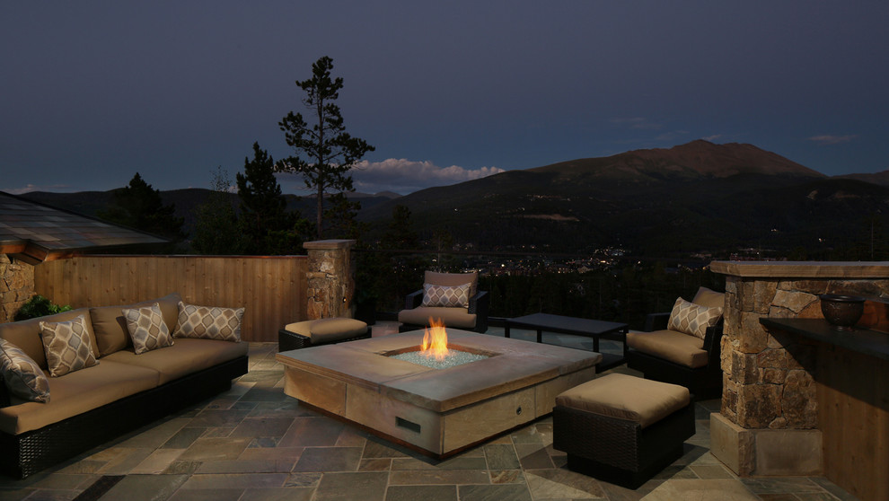 Design ideas for a large contemporary patio in Denver with an outdoor kitchen, tiled flooring and no cover.