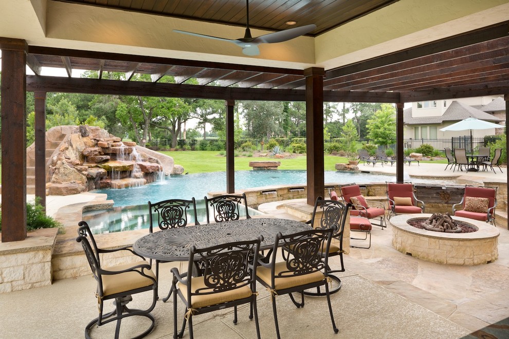 This is an example of a large mediterranean back patio in Houston.