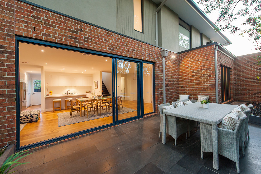 Photo of a classic back patio in Melbourne with no cover.