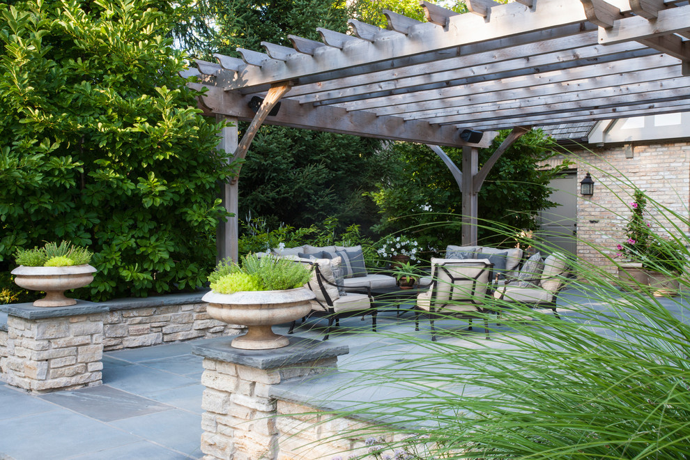 This is an example of a traditional patio in Chicago with a pergola.