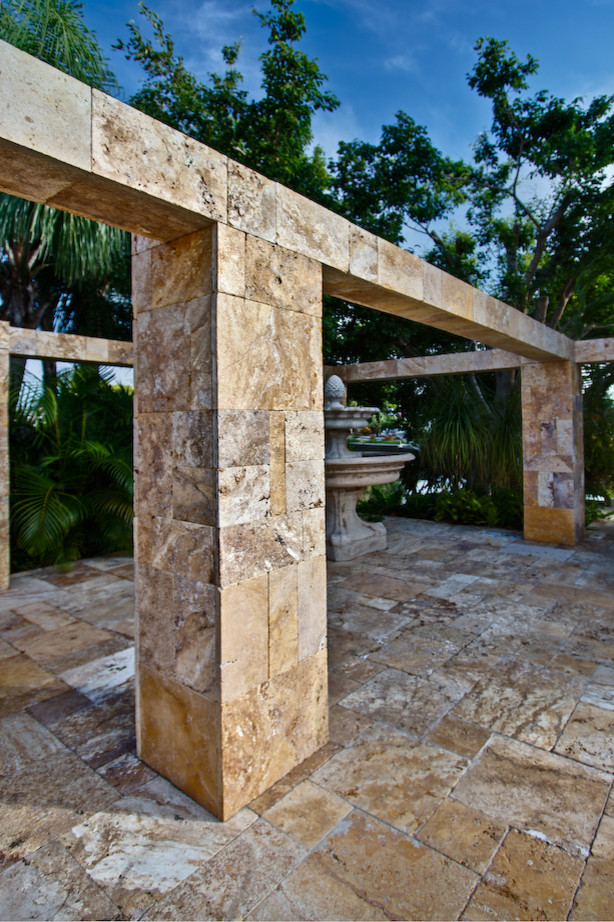 Example of an island style patio design in Other
