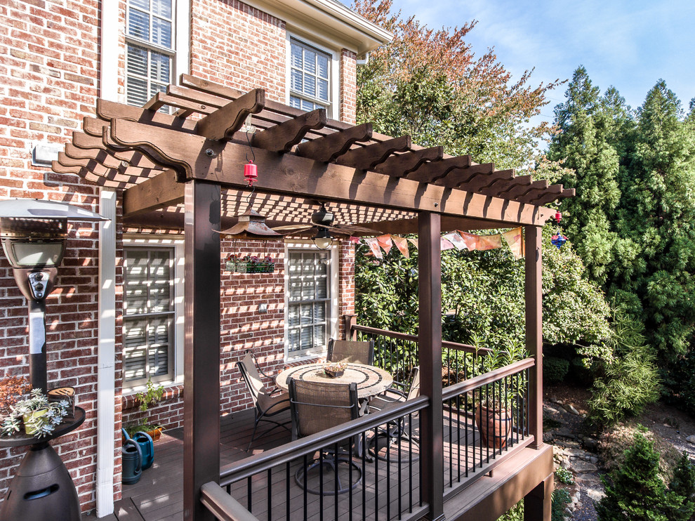 Inspiration for a large timeless backyard patio remodel in Atlanta with decking and a pergola