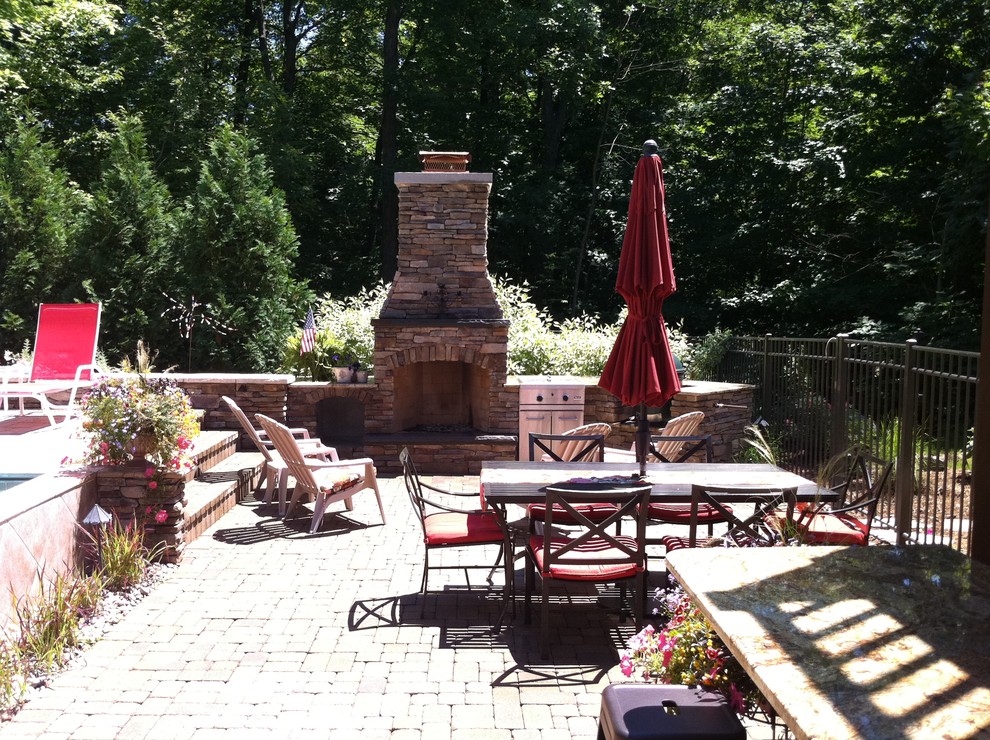 Grand Rapids Fireplace, Outdoor Kitchen, and Pool Traditional Patio
