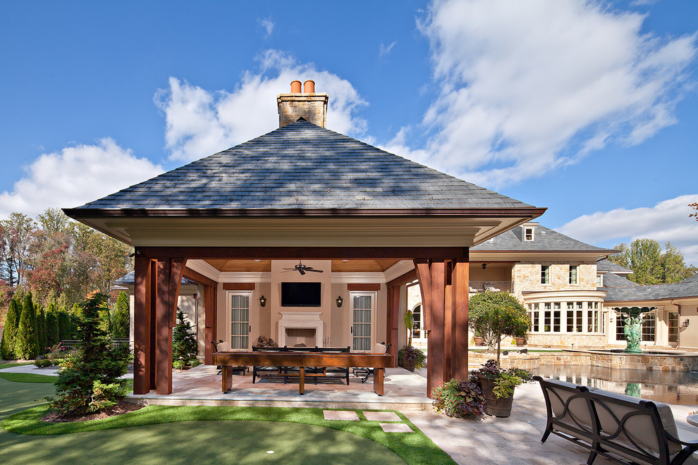 Elegant patio photo in DC Metro with a gazebo and a fire pit