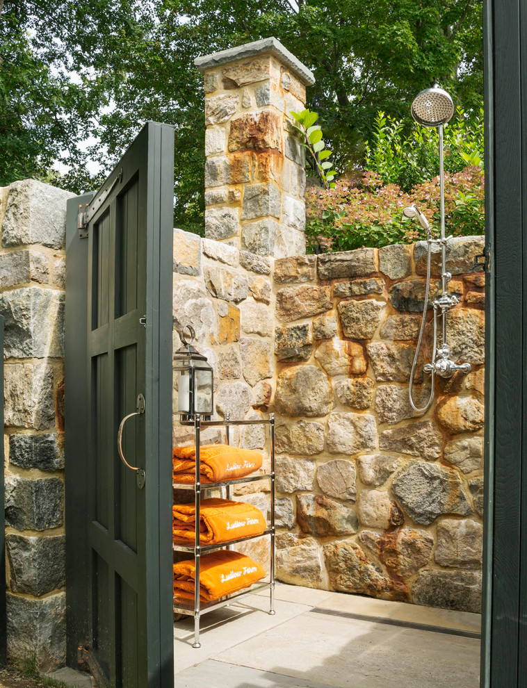 Inspiration for a classic back patio in New York with an outdoor shower and no cover.