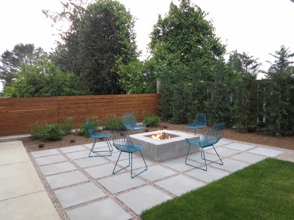 Patio - contemporary backyard concrete paver patio idea in Seattle with a fire pit