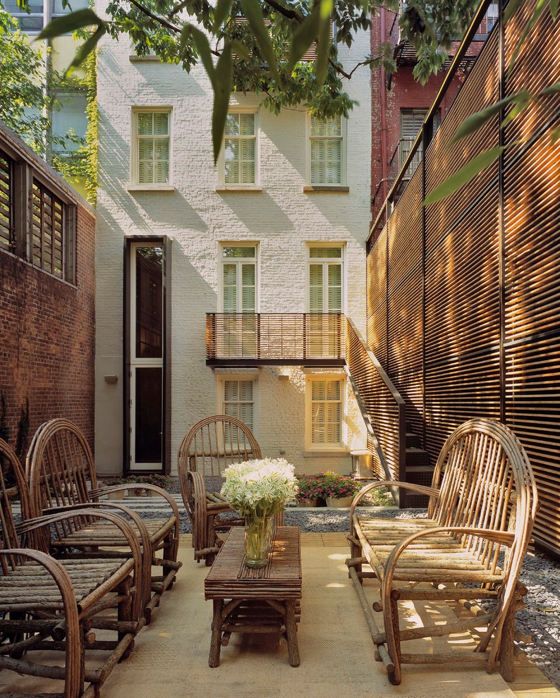 Example of a trendy backyard patio design in New York