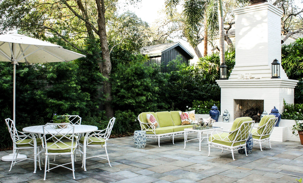 Inspiration for a traditional patio in Tampa with a fire feature.