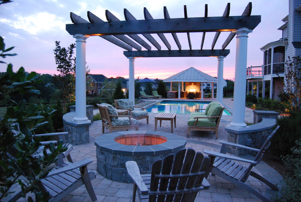 Elegant patio photo in DC Metro with a fire pit and a gazebo