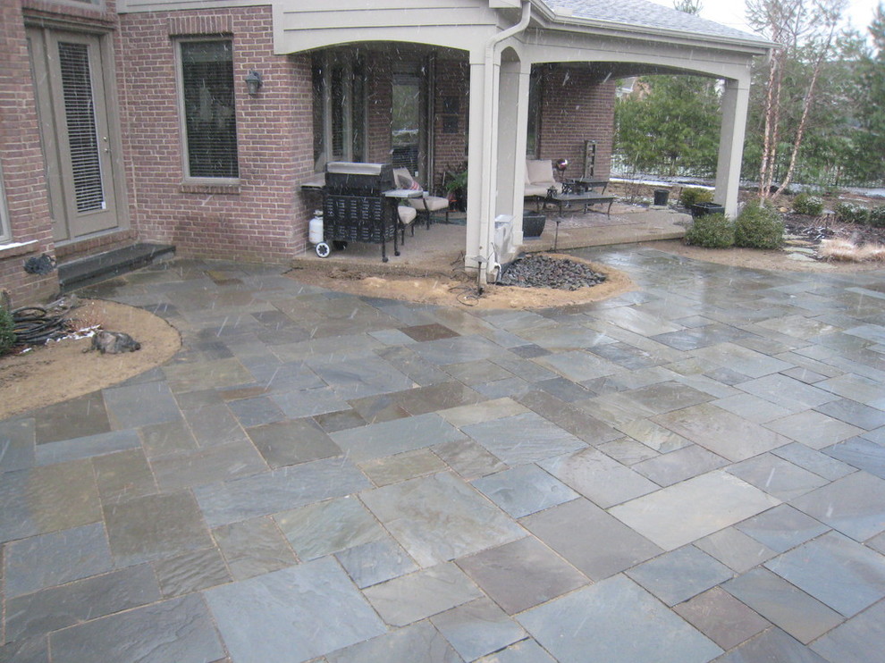 Design ideas for a large classic back patio in Other with concrete paving.