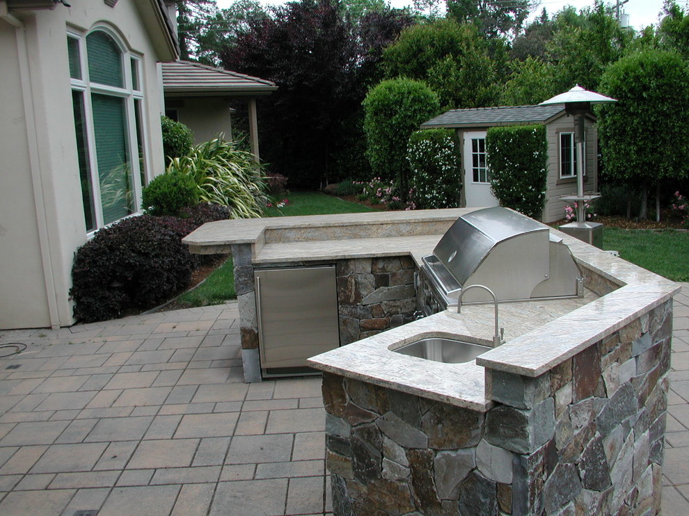 Patio kitchen - mid-sized transitional backyard concrete paver patio kitchen idea in San Francisco with no cover
