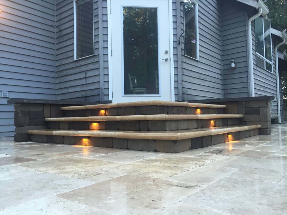 Design ideas for a medium sized contemporary back patio in Seattle with stamped concrete and no cover.