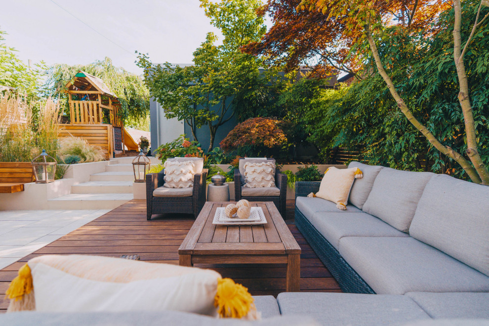 Example of a mid-sized trendy backyard patio design in Vancouver
