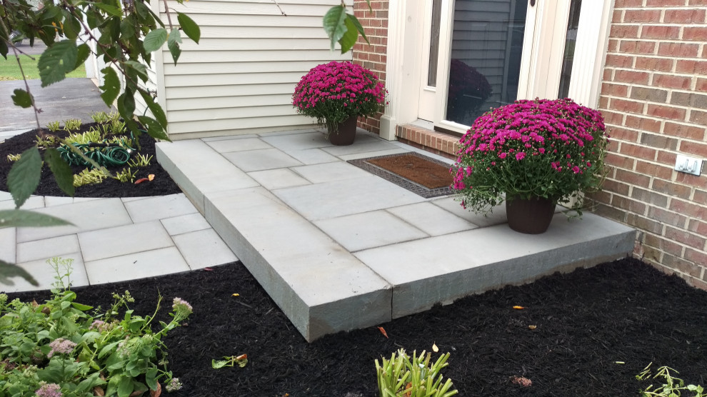 Traditional front patio in Philadelphia with natural stone paving.
