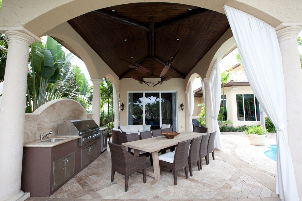 Inspiration for a medium sized mediterranean back patio in Miami with concrete paving, a gazebo and a bbq area.