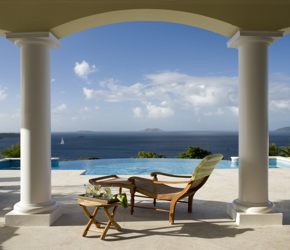 Patio - tropical patio idea in Miami with a roof extension