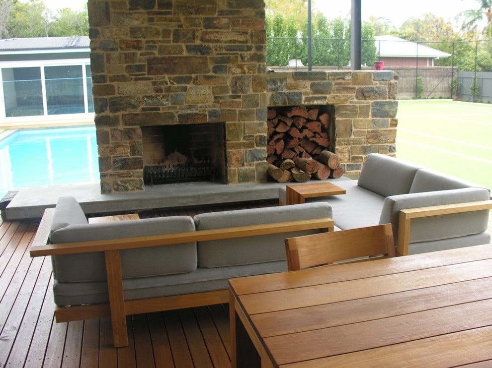 Design ideas for a medium sized contemporary back patio in Adelaide with a fire feature, decking and a roof extension.