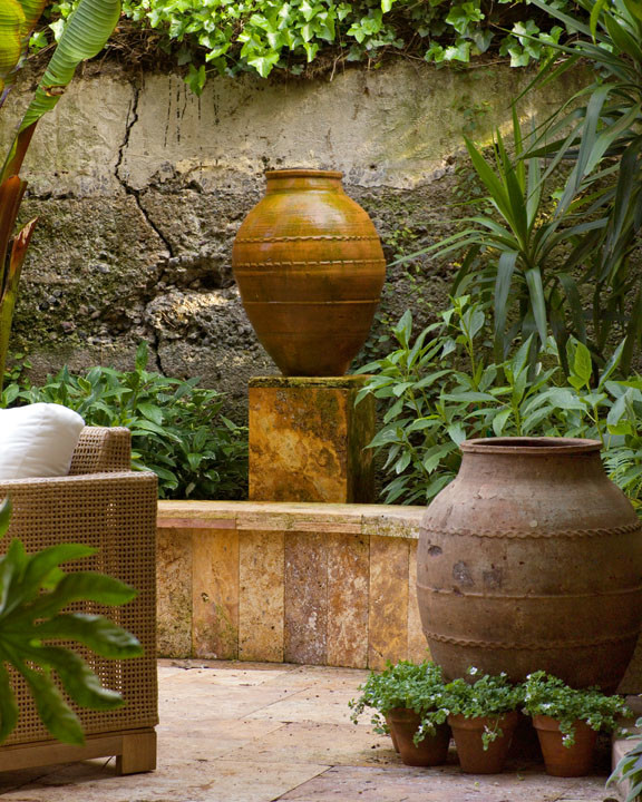 Inspiration for a mid-sized tropical backyard tile patio remodel in San Francisco with no cover