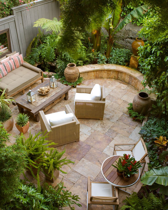 Example of a mid-sized island style backyard tile patio design in San Francisco with no cover