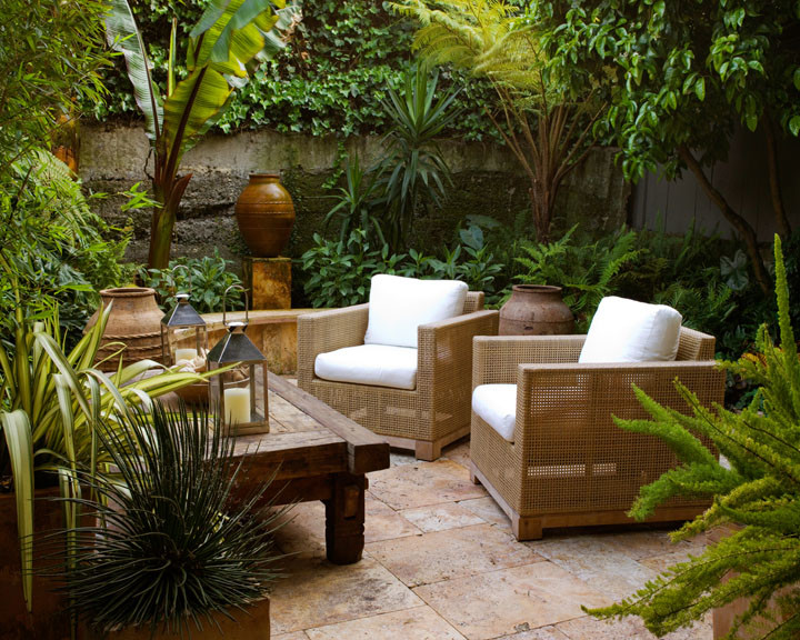 This is an example of a medium sized world-inspired back patio in San Francisco with tiled flooring and no cover.