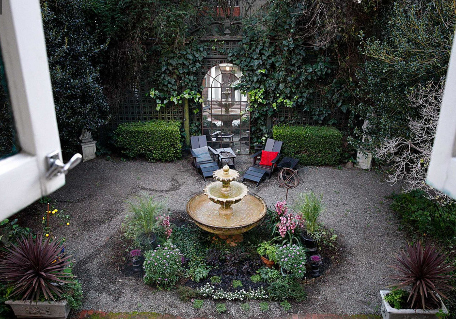 Design ideas for a medium sized victorian courtyard patio in San Francisco with a water feature, gravel and no cover.
