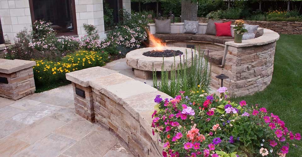 Example of a small transitional backyard stone patio design in San Francisco with a fire pit and no cover